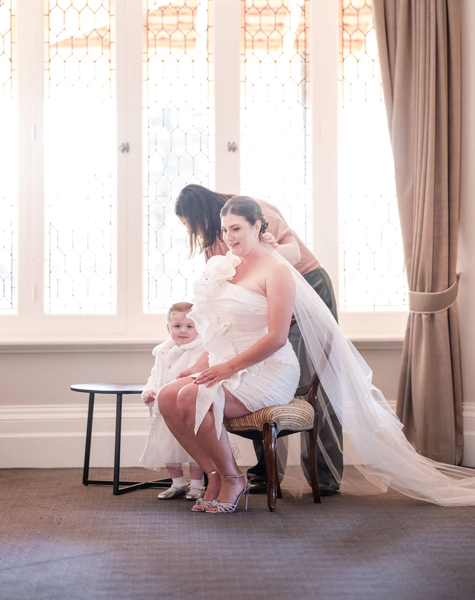 glenelg's partridge house wedding - emma & steven 132 Bride being prepared in lit window