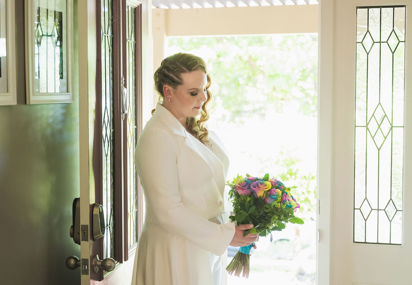 tiny house on the prairie wedding - kat & stacey 67 bride contemplating bouquet