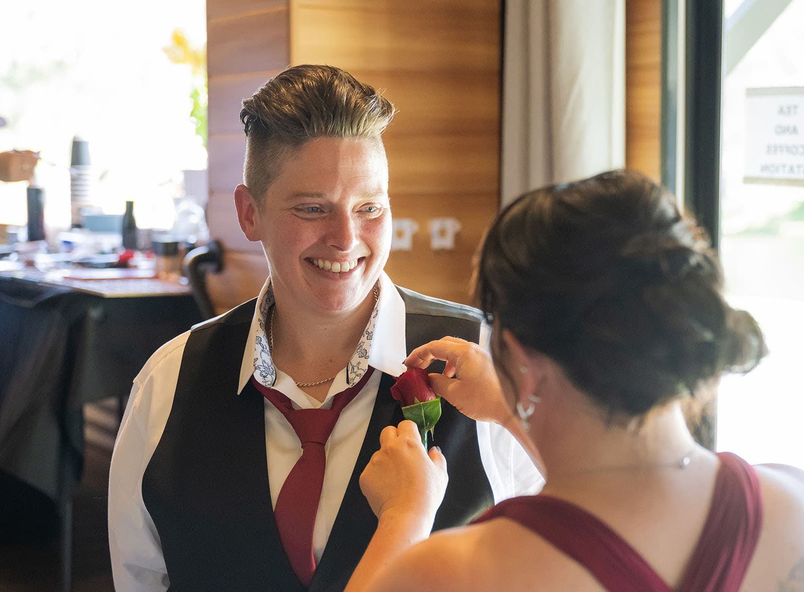 tiny house on the prairie wedding - kat & stacey 62 bride having flower attached to lapel