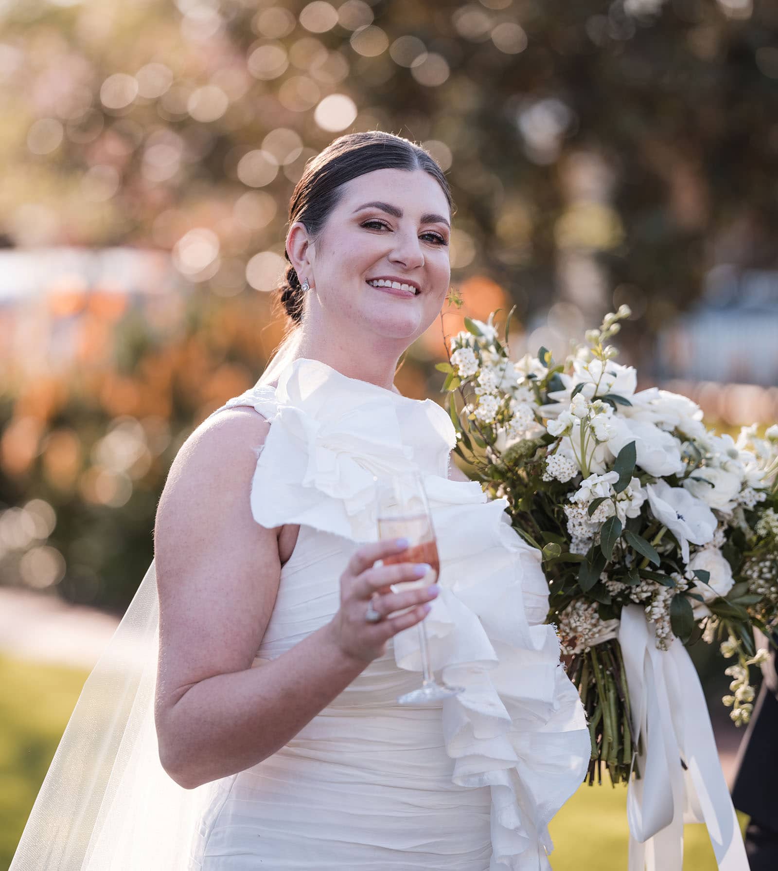 glenelg's partridge house wedding - emma & steven 149 bride looking happy with a drink