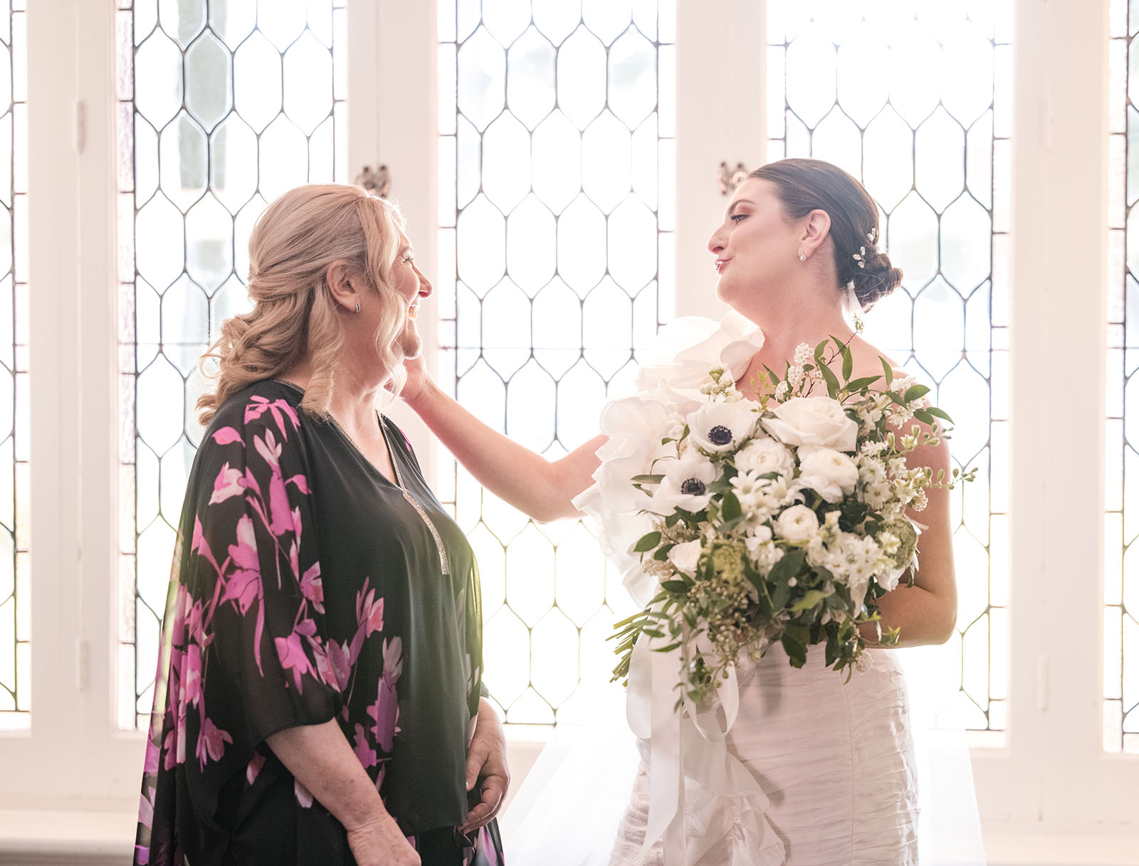 glenelg's partridge house wedding - emma & steven 139 bride reaching out to Mum during preparation