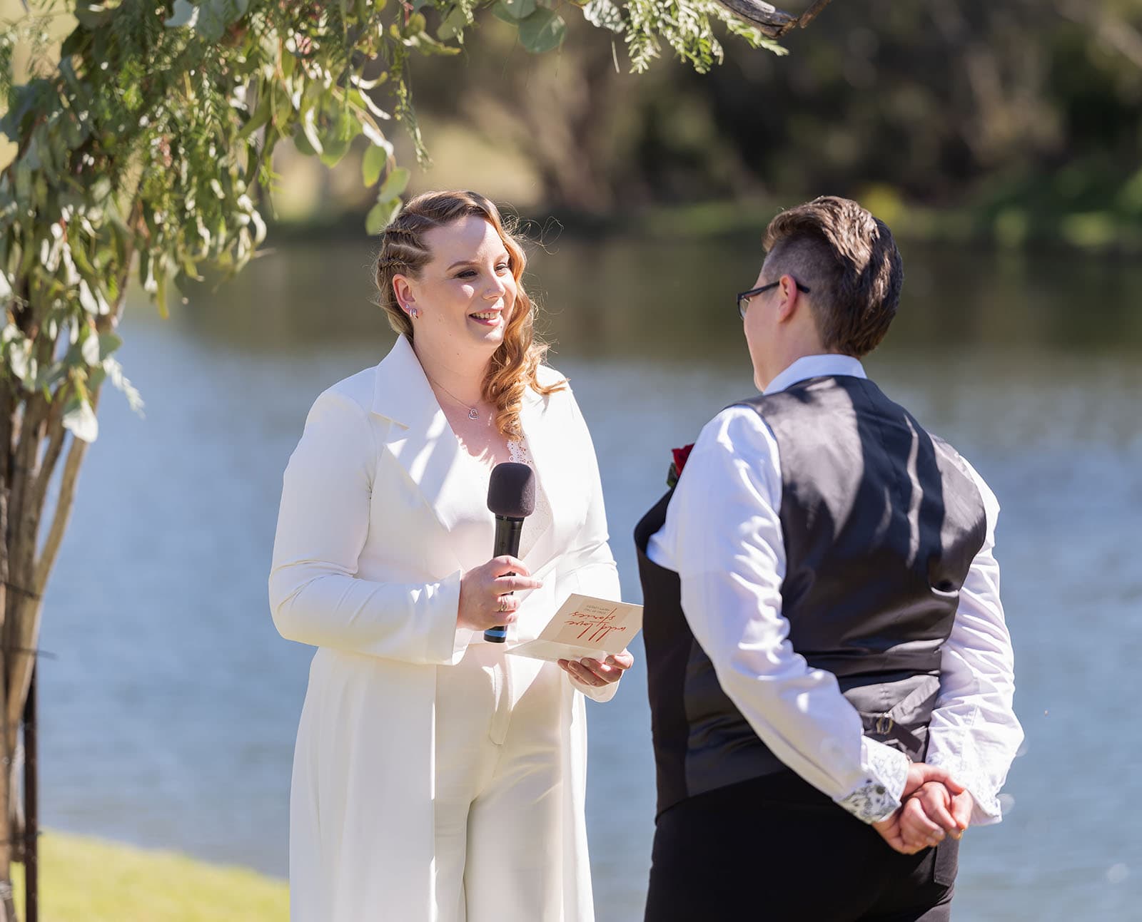 tiny house on the prairie wedding - kat & stacey 89 Bride reciting vows with microphone