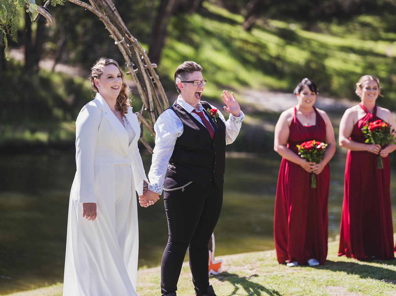 tiny house on the prairie wedding - kat & stacey 86 Bride waving at crowd