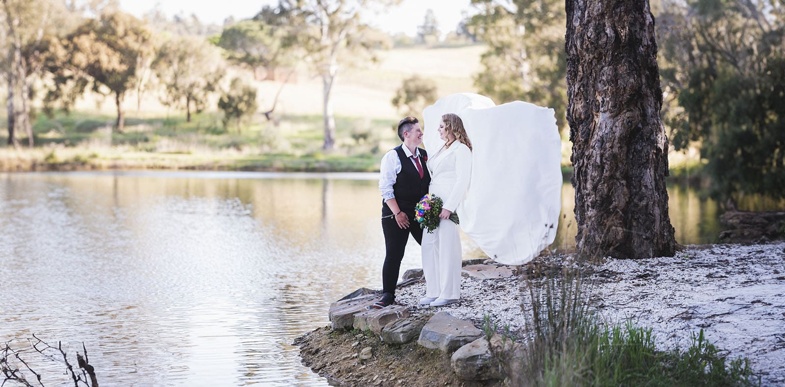 tiny house on the prairie wedding - kat & stacey 99 Brides on edge of lake together
