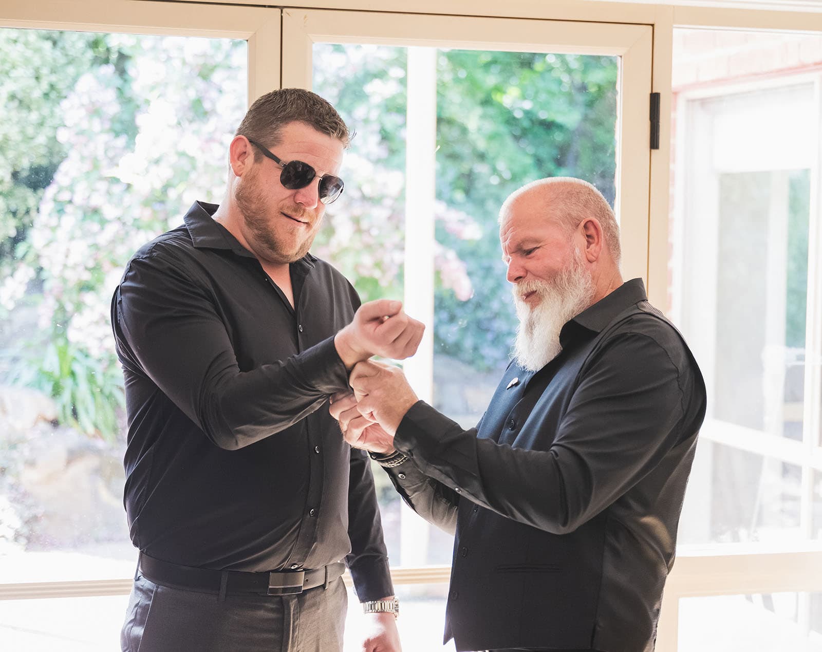 tiny house on the prairie wedding - kat & stacey 74 Bridesdude having cufflinks put on