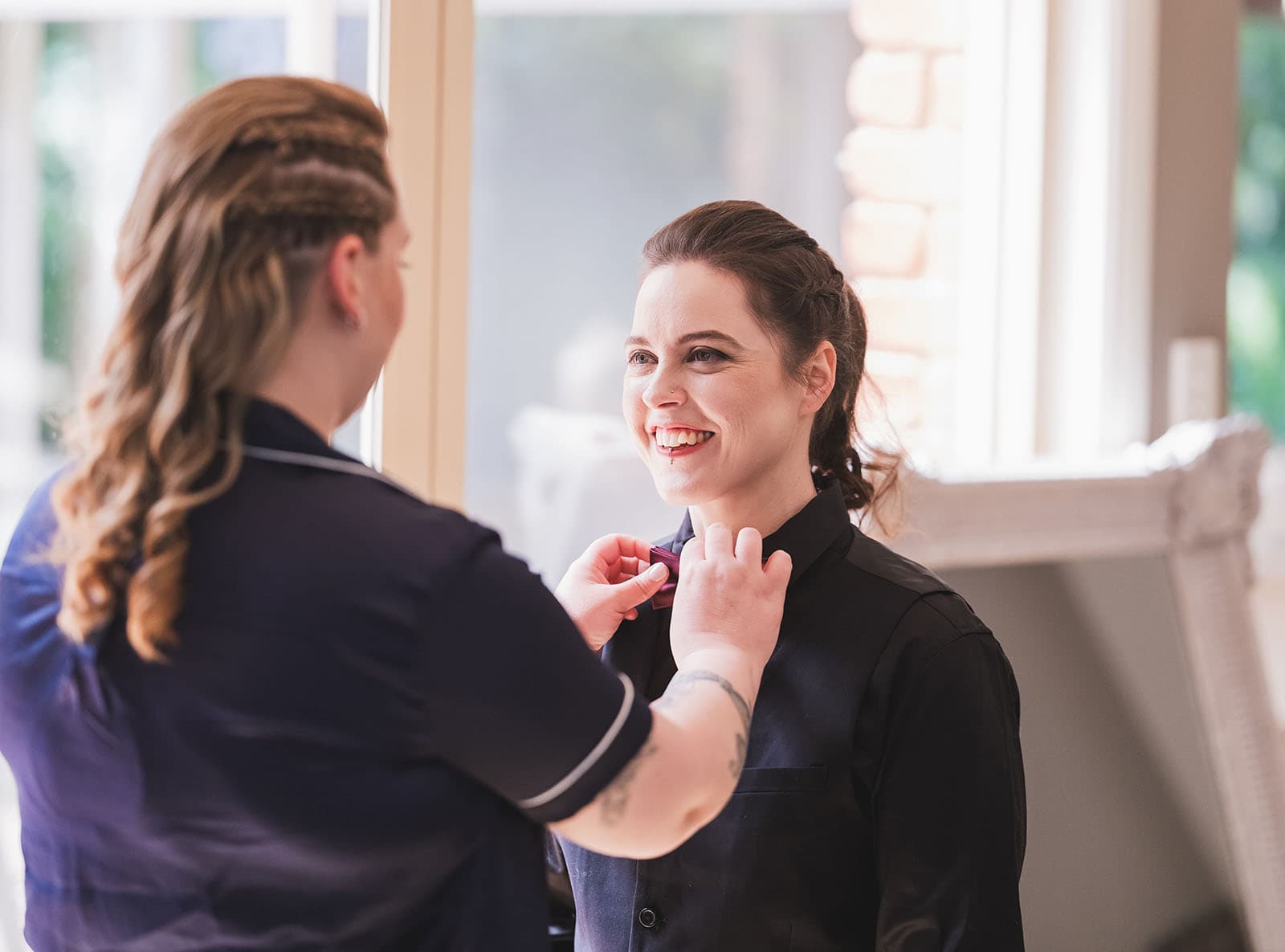 tiny house on the prairie wedding - kat & stacey 75 Bridesmaid having collar adjusted