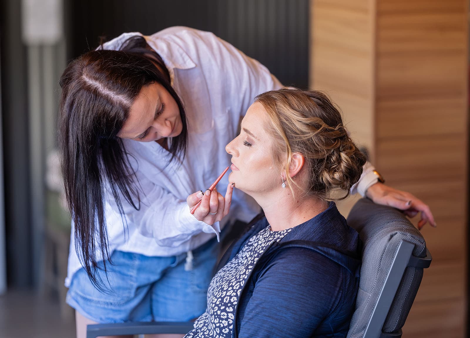 tiny house on the prairie wedding - kat & stacey 56 Bridesmaid having makeup done