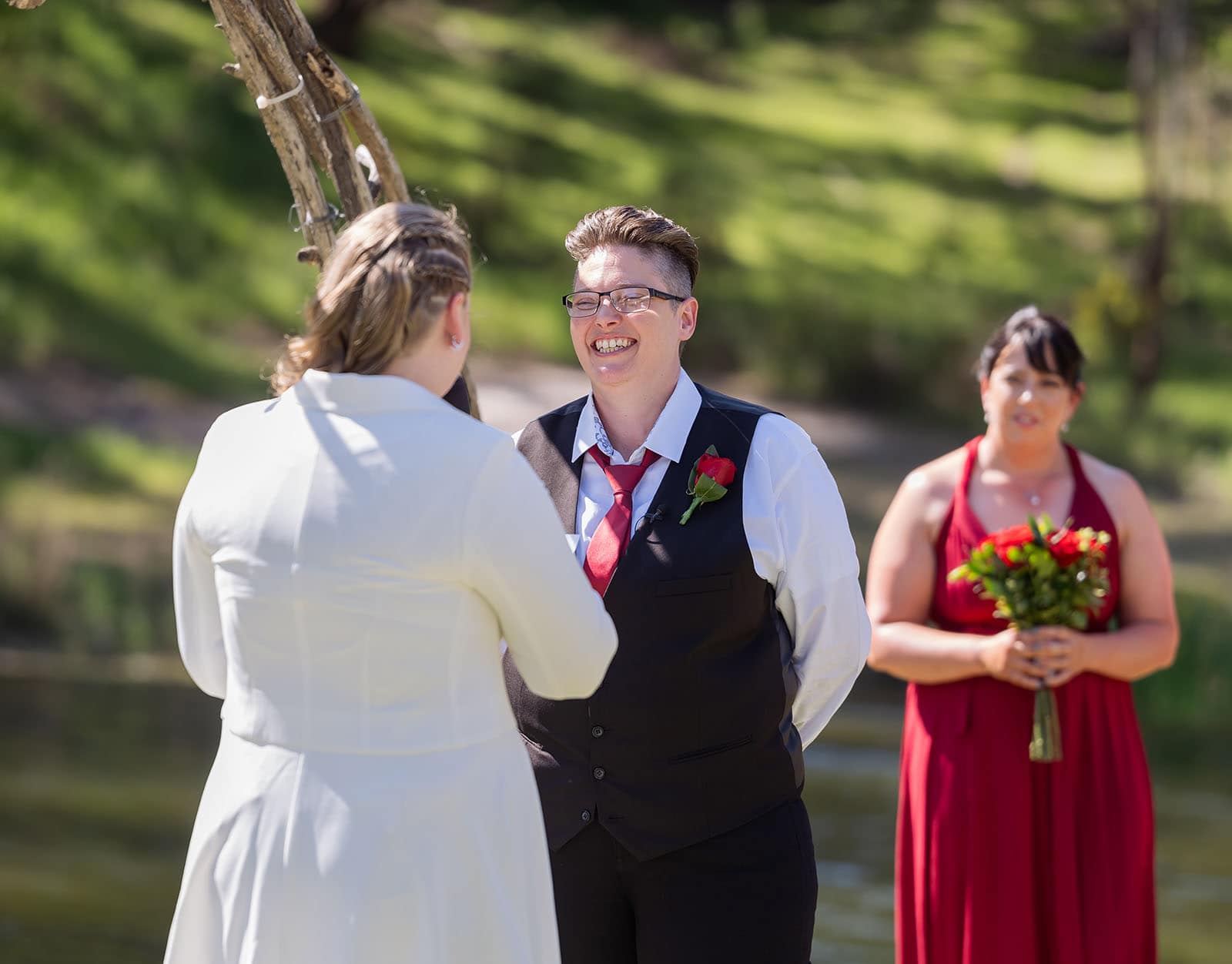 tiny house on the prairie wedding - kat & stacey 88 Grinning bride at ceremony