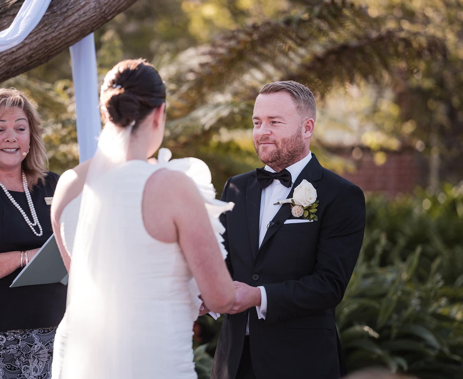 glenelg's partridge house wedding - emma & steven 142 Groom holdingbrides hands