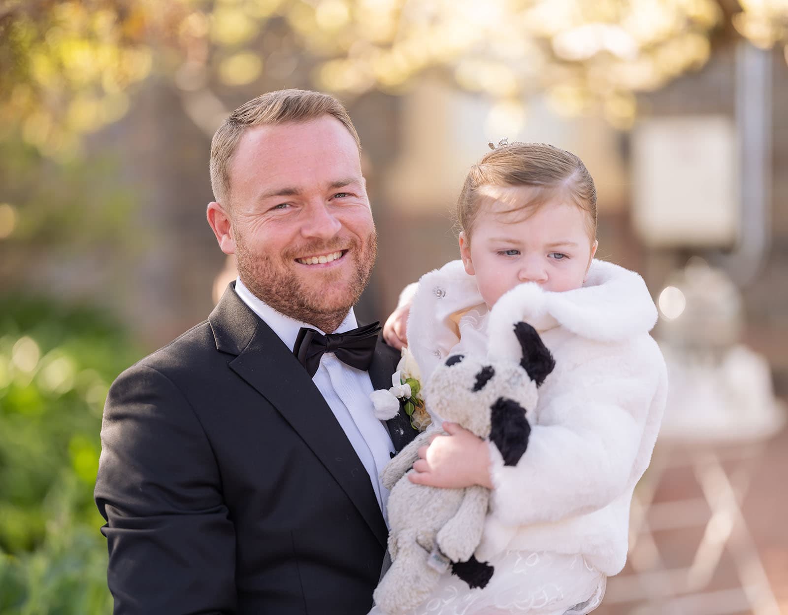 glenelg's partridge house wedding - emma & steven 140 Groom smiling with little one