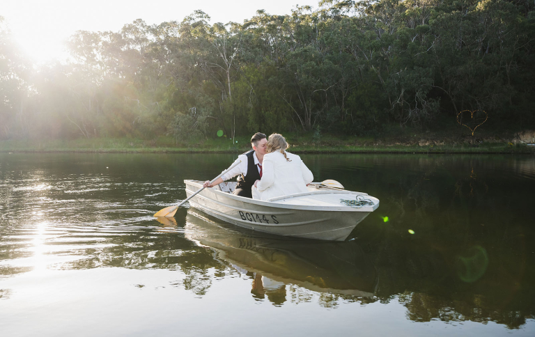 Kiss on a row boat
