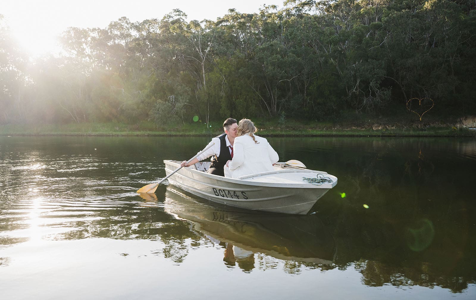 tiny house on the prairie wedding - kat & stacey 106 Kiss on a row boat