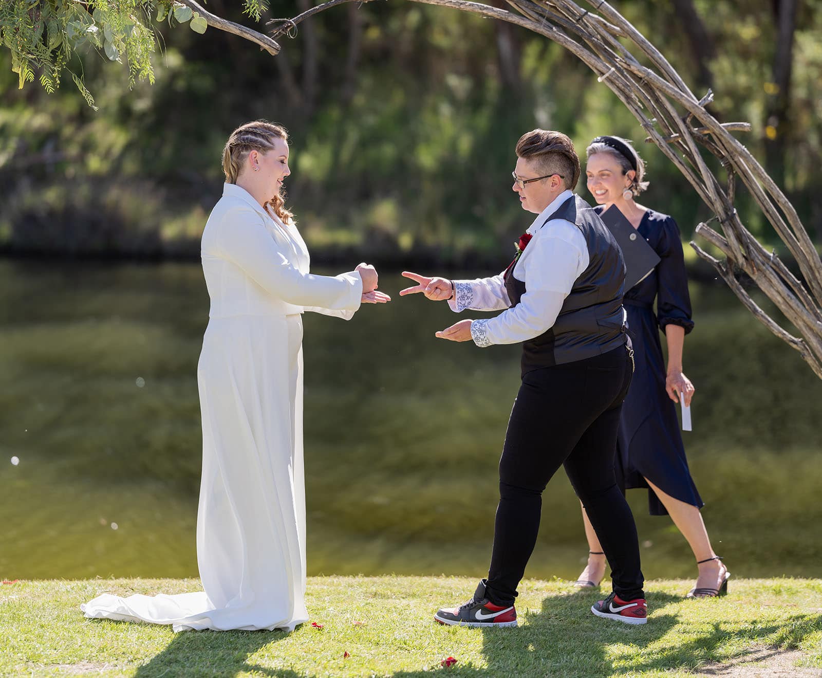 tiny house on the prairie wedding - kat & stacey 87 Rock paper scissors during ceremony
