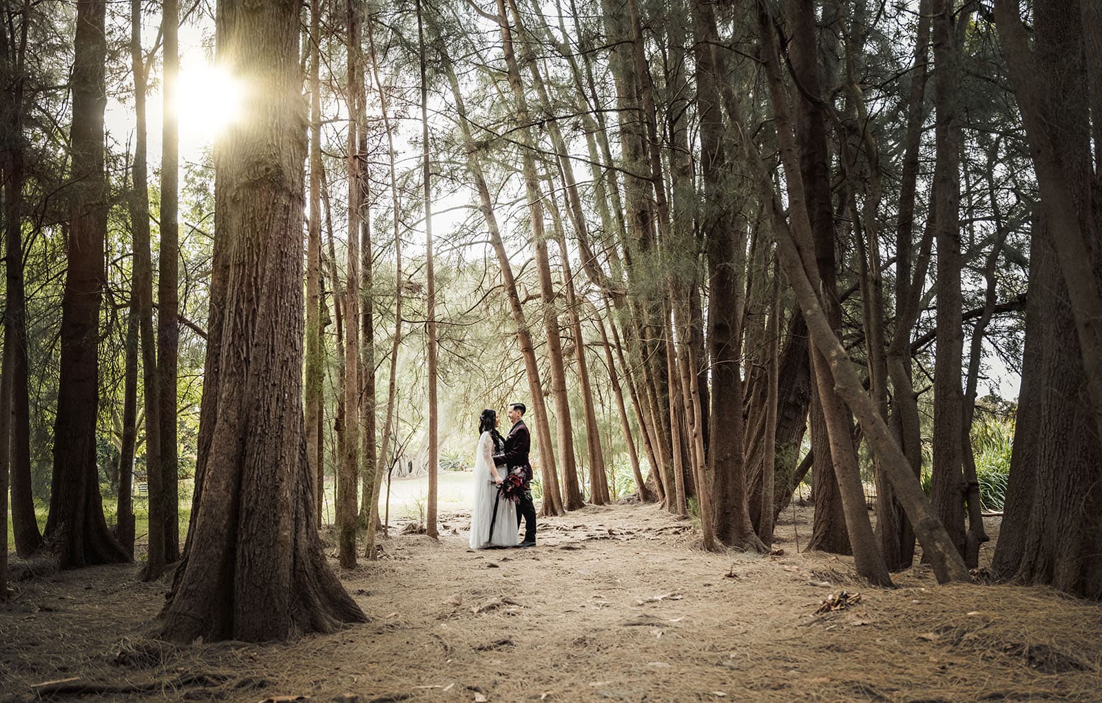 palm house gardens wedding - ayla & drew 179 bridal couple in forest under sun