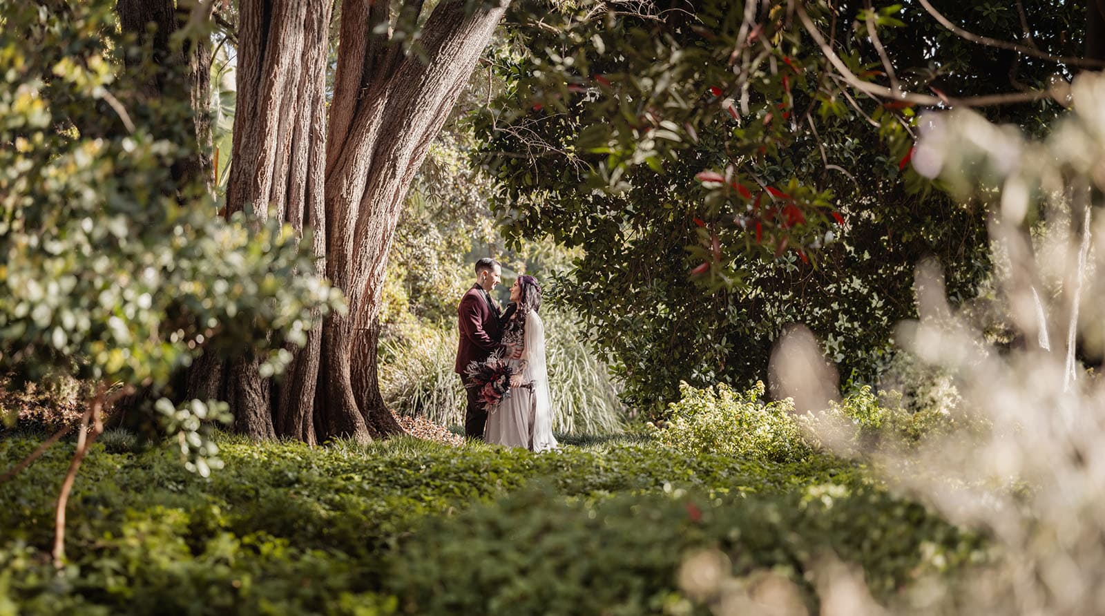 palm house gardens wedding - ayla & drew 161 Bridal couple in the trees