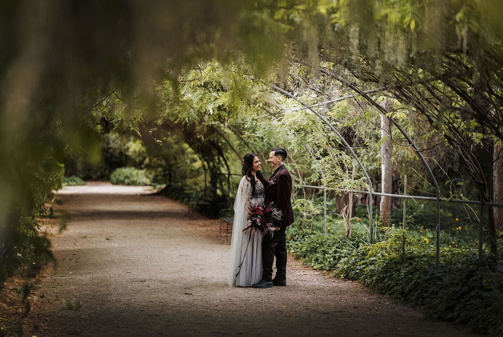 palm house gardens wedding - ayla & drew 180 Bridal couple under green arch
