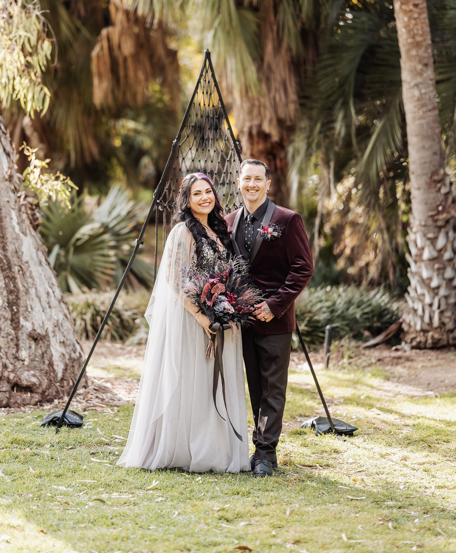 palm house gardens wedding - ayla & drew 156 Bridal couple under triangular arbour