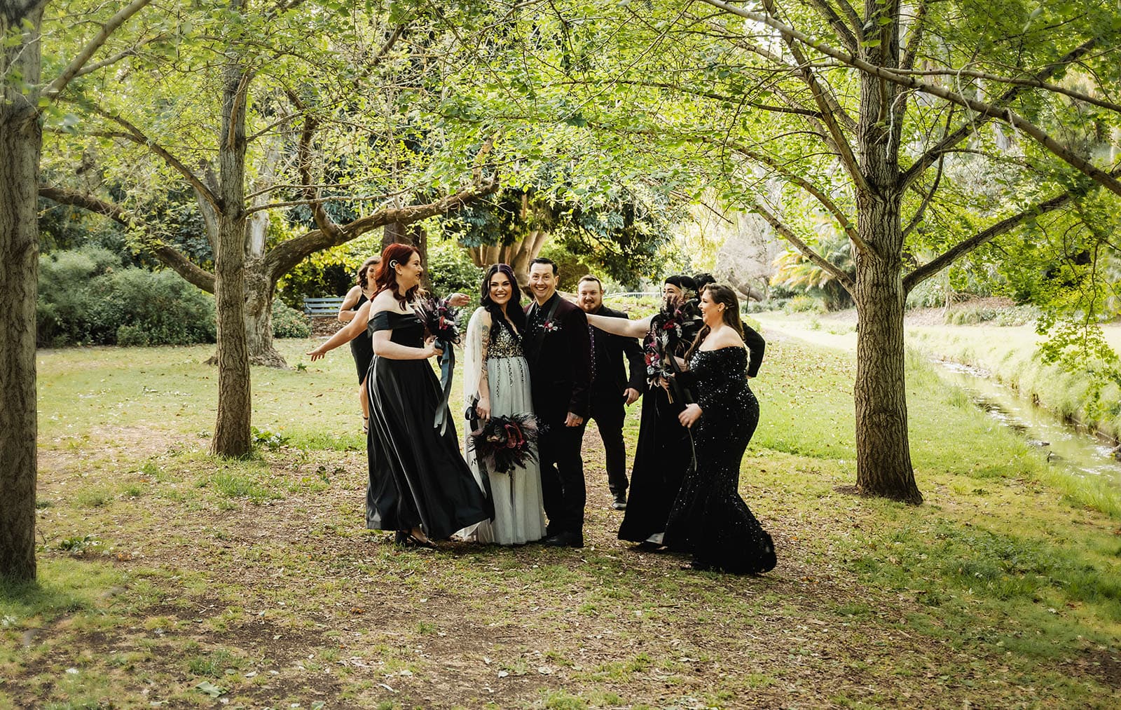 palm house gardens wedding - ayla & drew 164 Bridal party hugging bride and groom