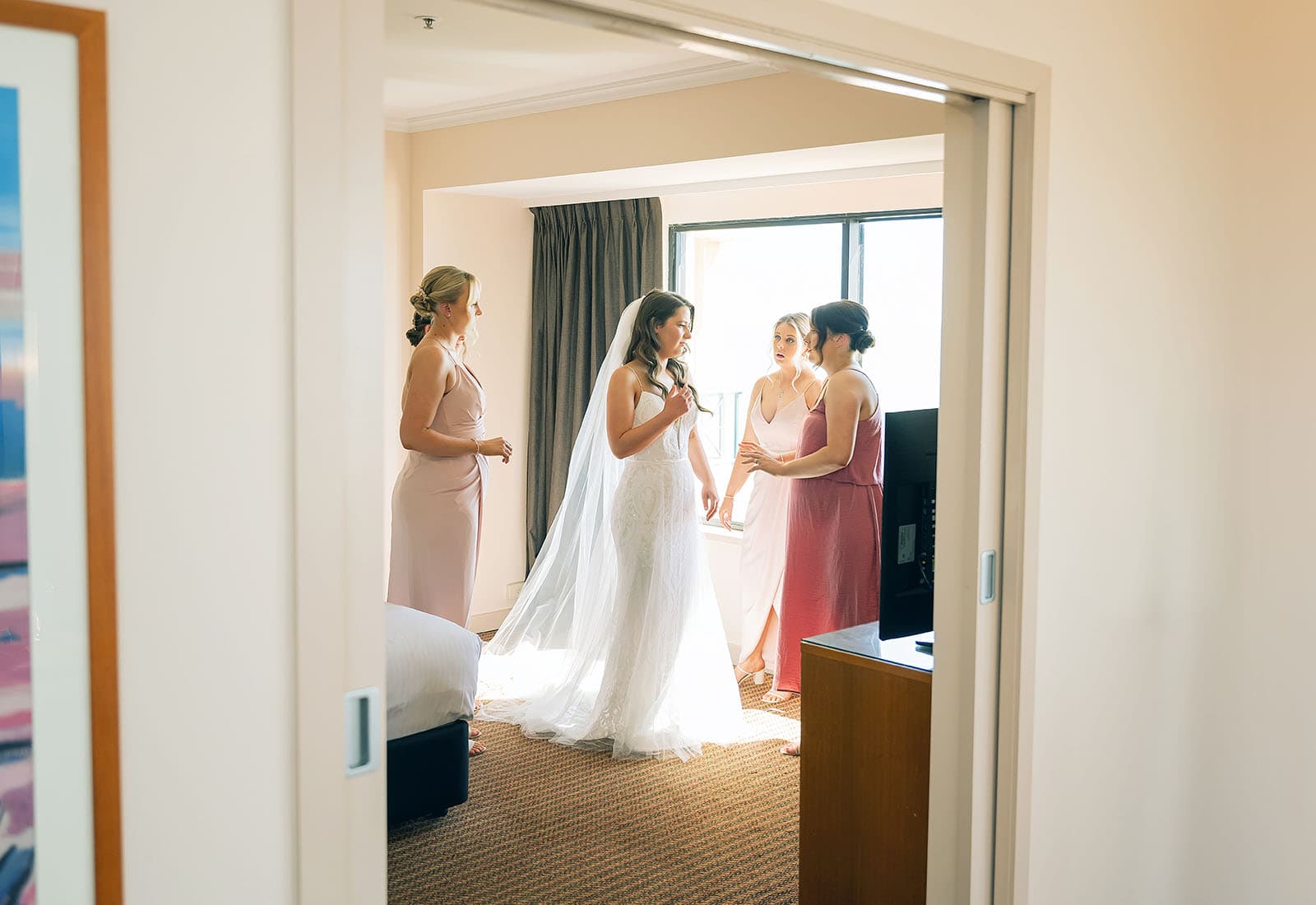 stamford grand wedding - jess & tim 57 Bride and bridal party through doors
