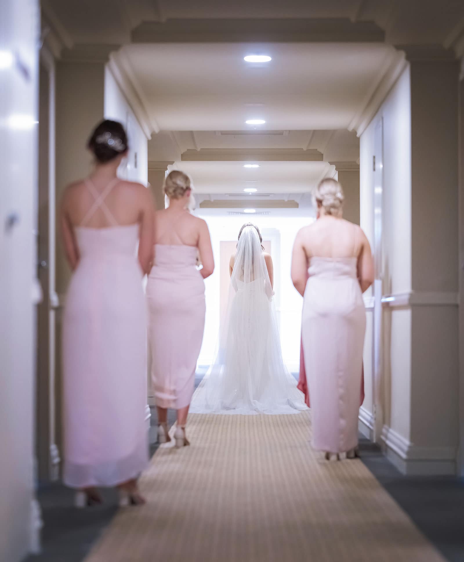 stamford grand wedding - jess & tim 59 Bride and bridal party walking down hallway