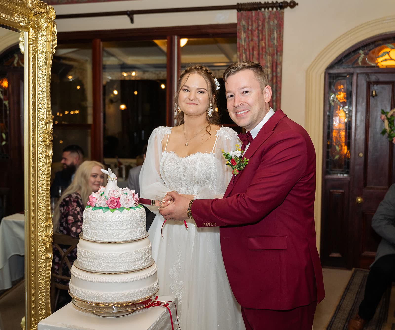 templewood house wedding - michelle & andrew 48 Bride and groom cutting their cake