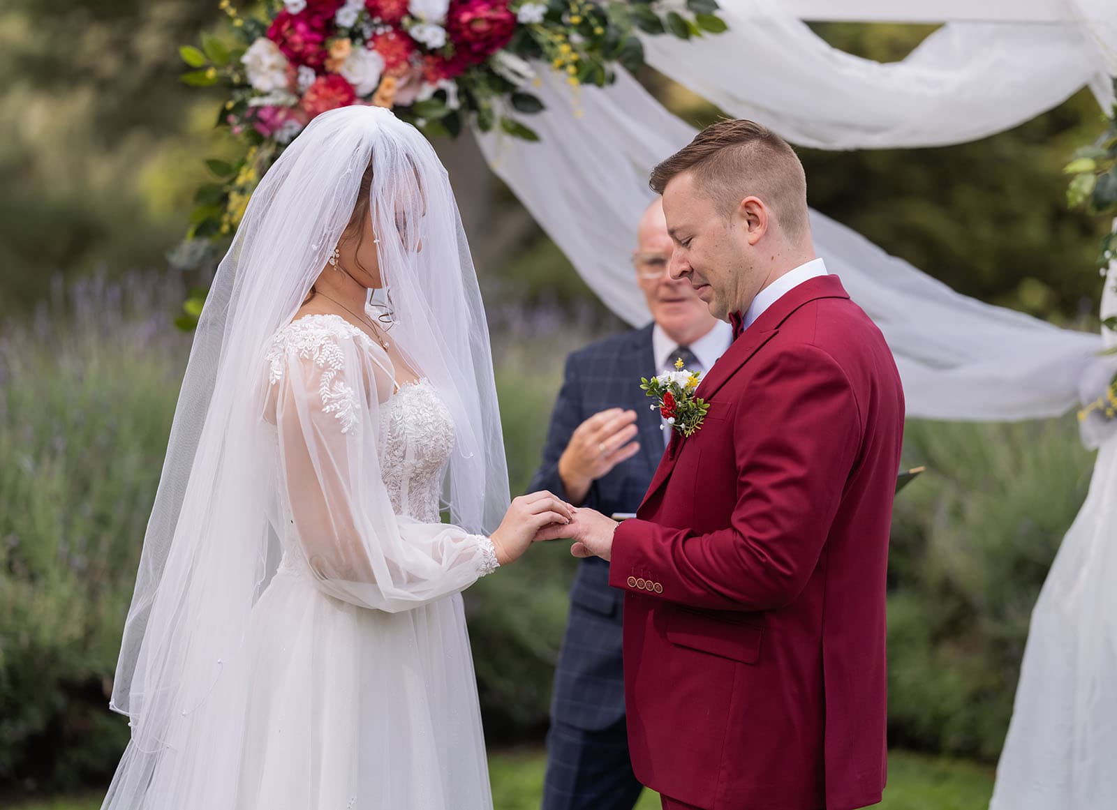 templewood house wedding - michelle & andrew 19 Bride and groom exchanging rings
