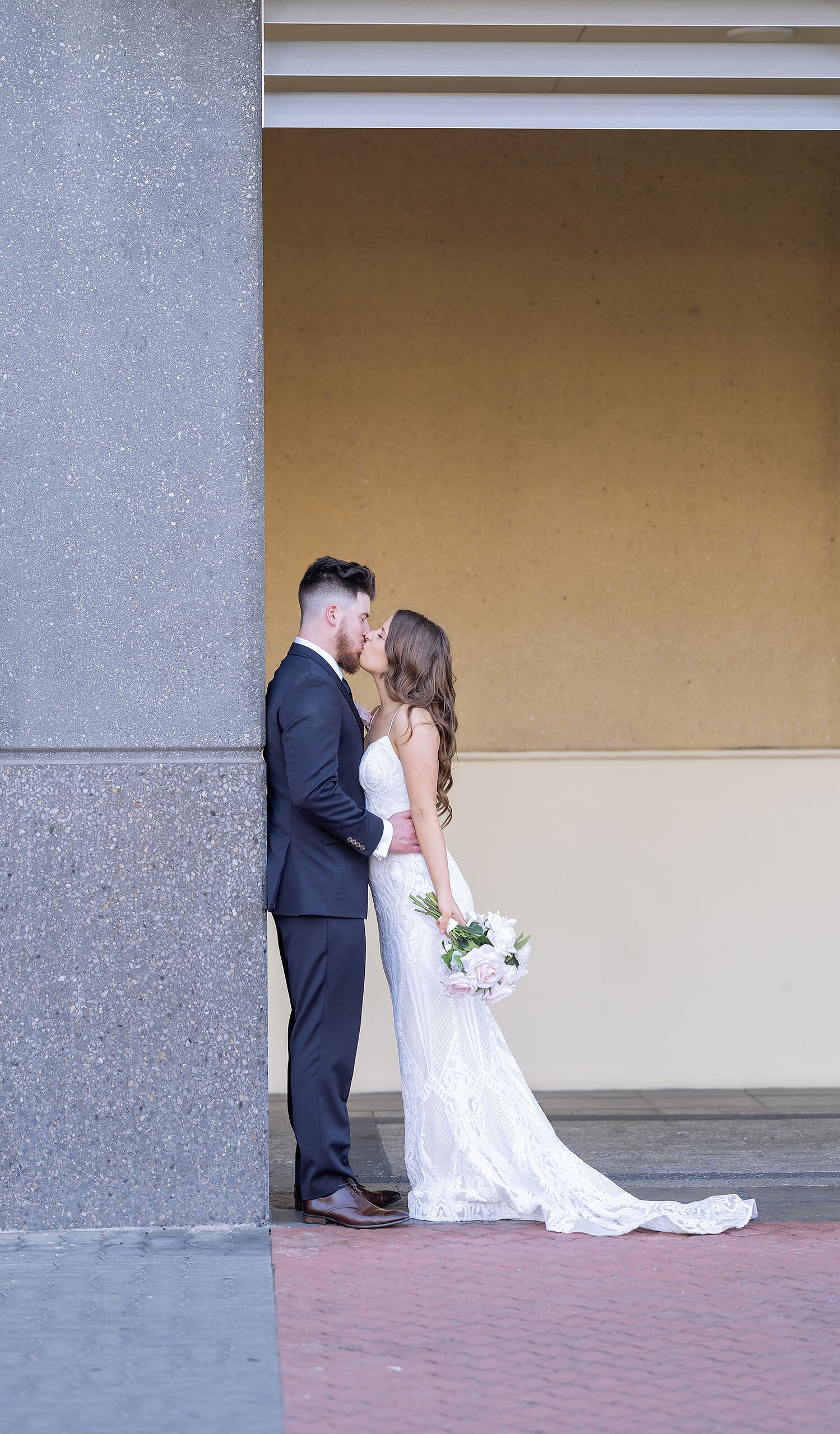 stamford grand wedding - jess & tim 81 Bride and groom leaning on pillar