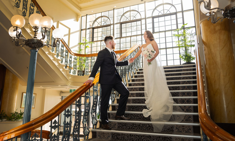 stamford grand wedding - jess & tim 3 Bride and groom on staircase