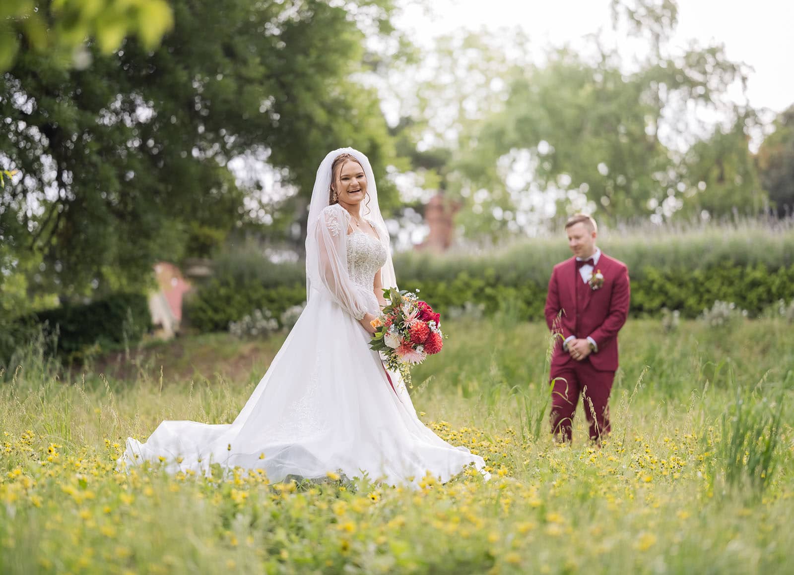 templewood house wedding - michelle & andrew 29 Bride and groom standing in long grass