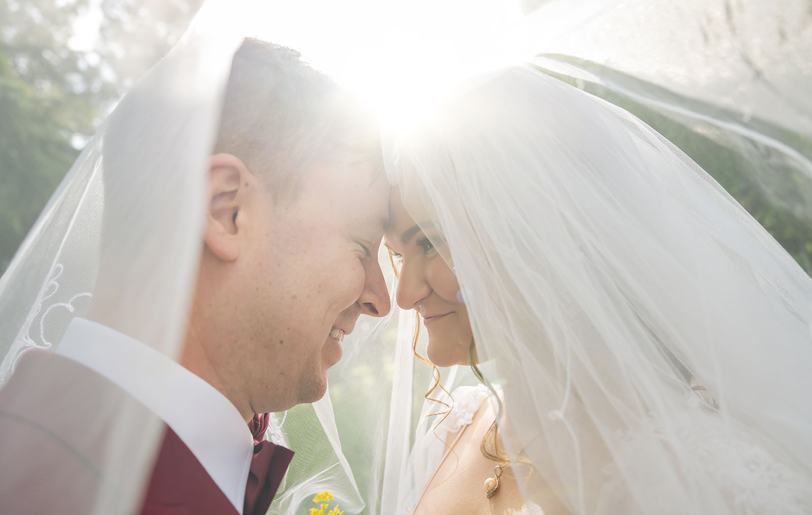 templewood house wedding - michelle & andrew 31 Bride and groom together under veil