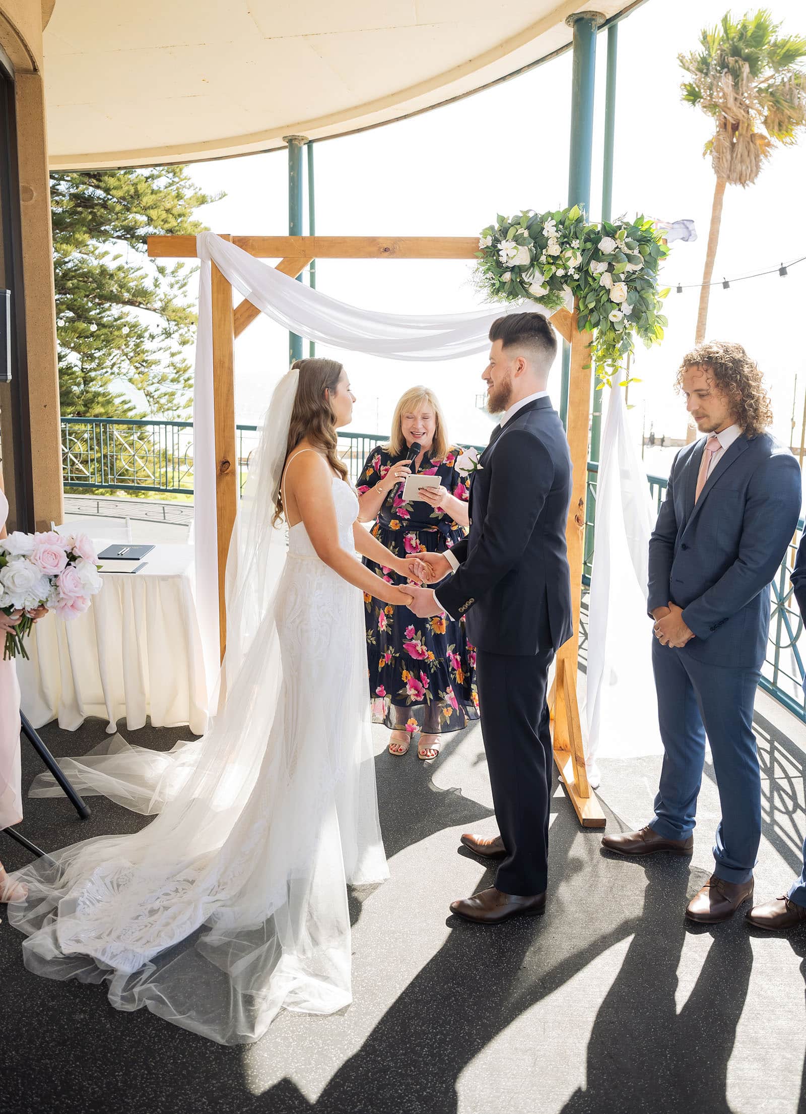 stamford grand wedding - jess & tim 62 Bride and groom under arbour