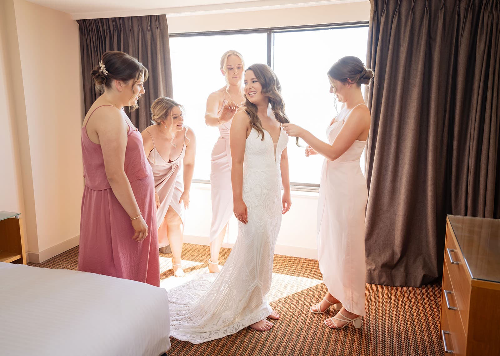 stamford grand wedding - jess & tim 55 Bride being preparaed with bridal party