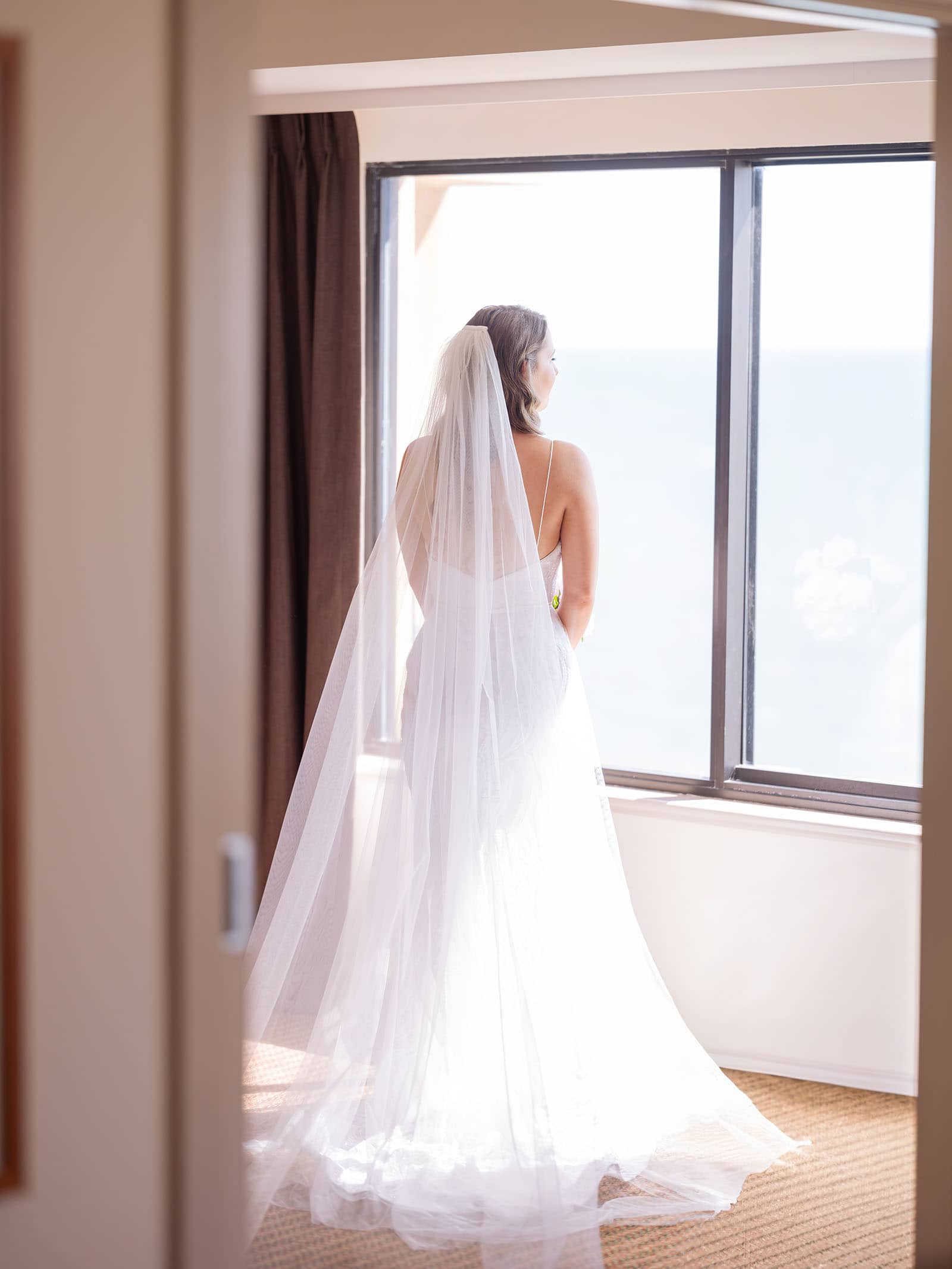 stamford grand wedding - jess & tim 58 Bride looking out window