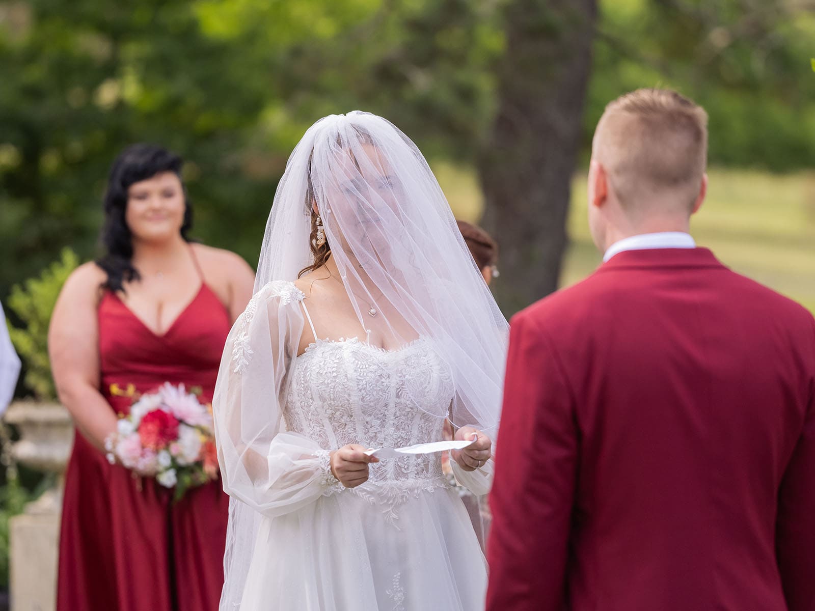 templewood house wedding - michelle & andrew 17 Bride wearing veil during ceremony