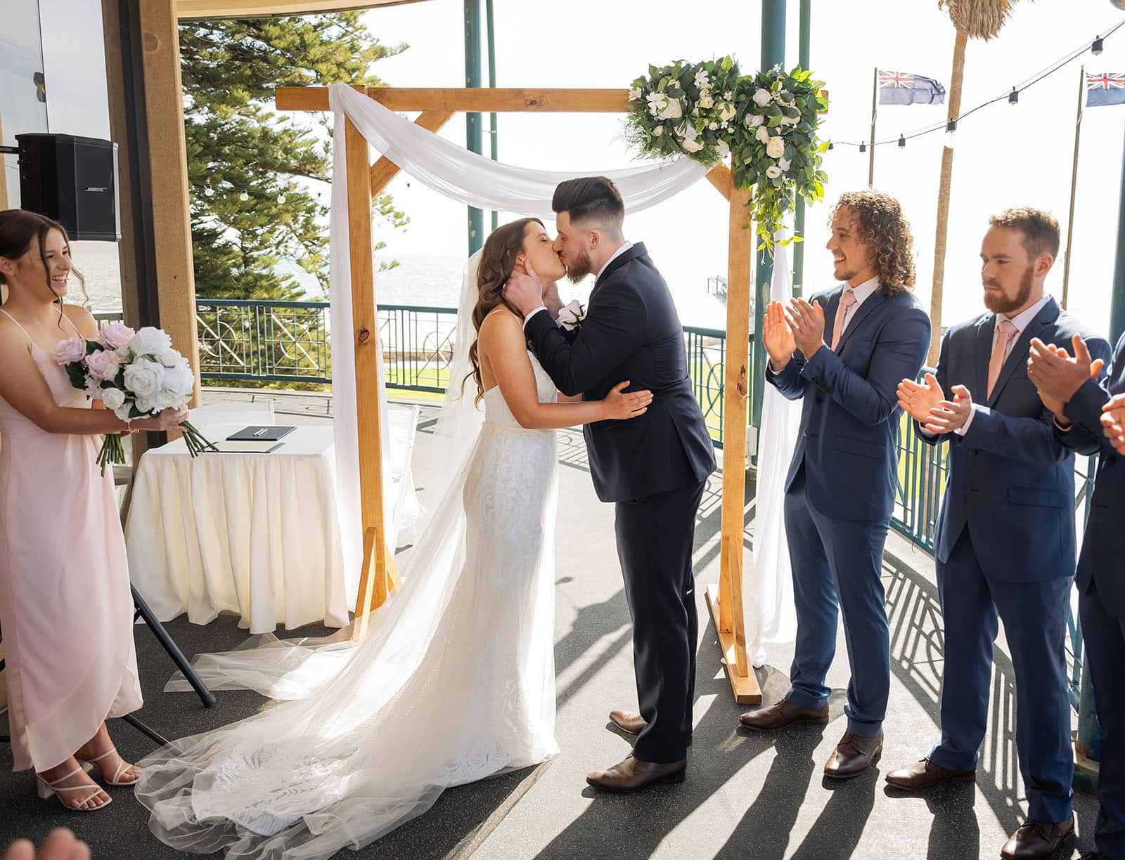 stamford grand wedding - jess & tim 66 First kiss at Stamford Grand wedding ceremony on balcony
