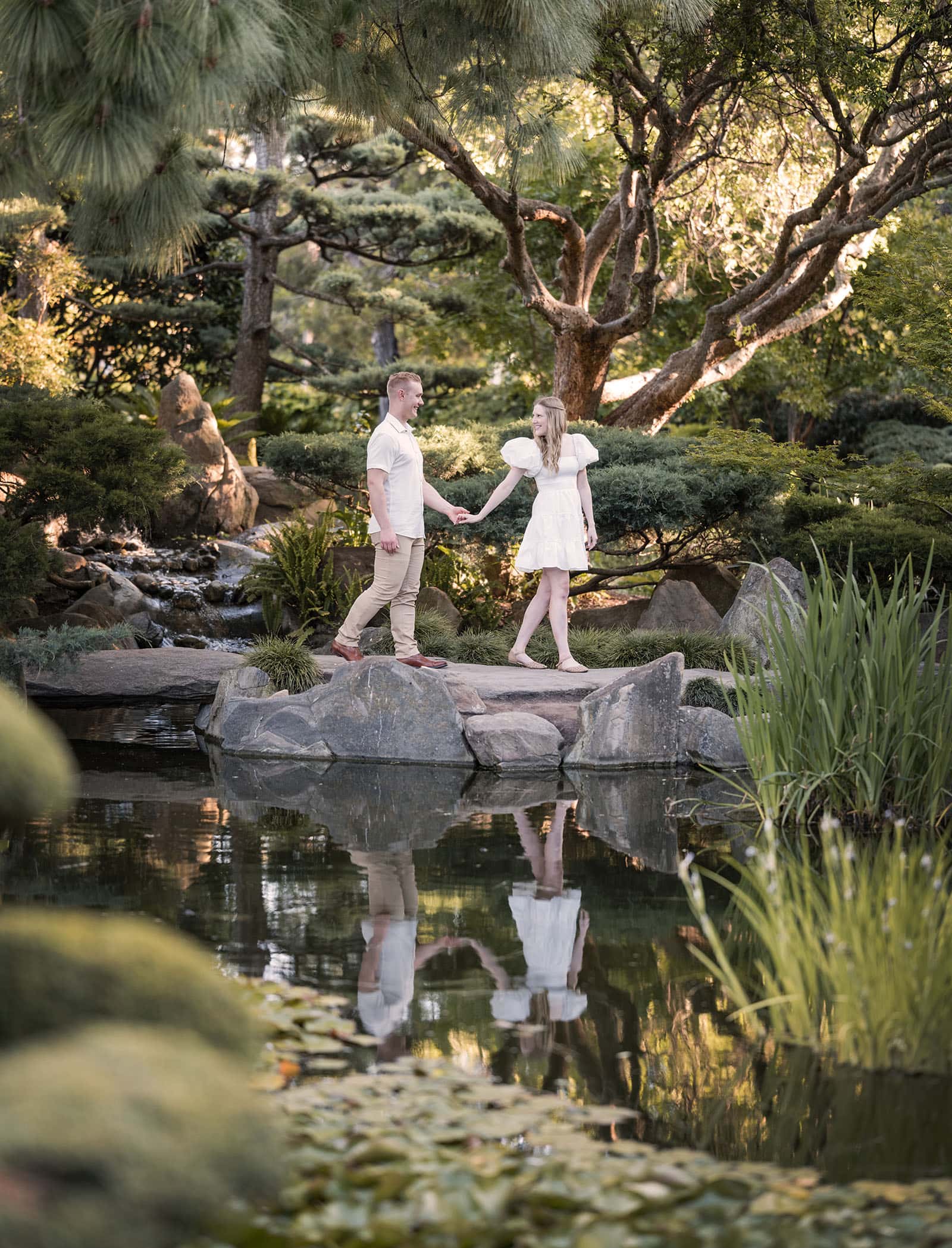 adelaide parklands engagement shoot - stacey & jacob 191 Hand-in-hand walk across koi pond