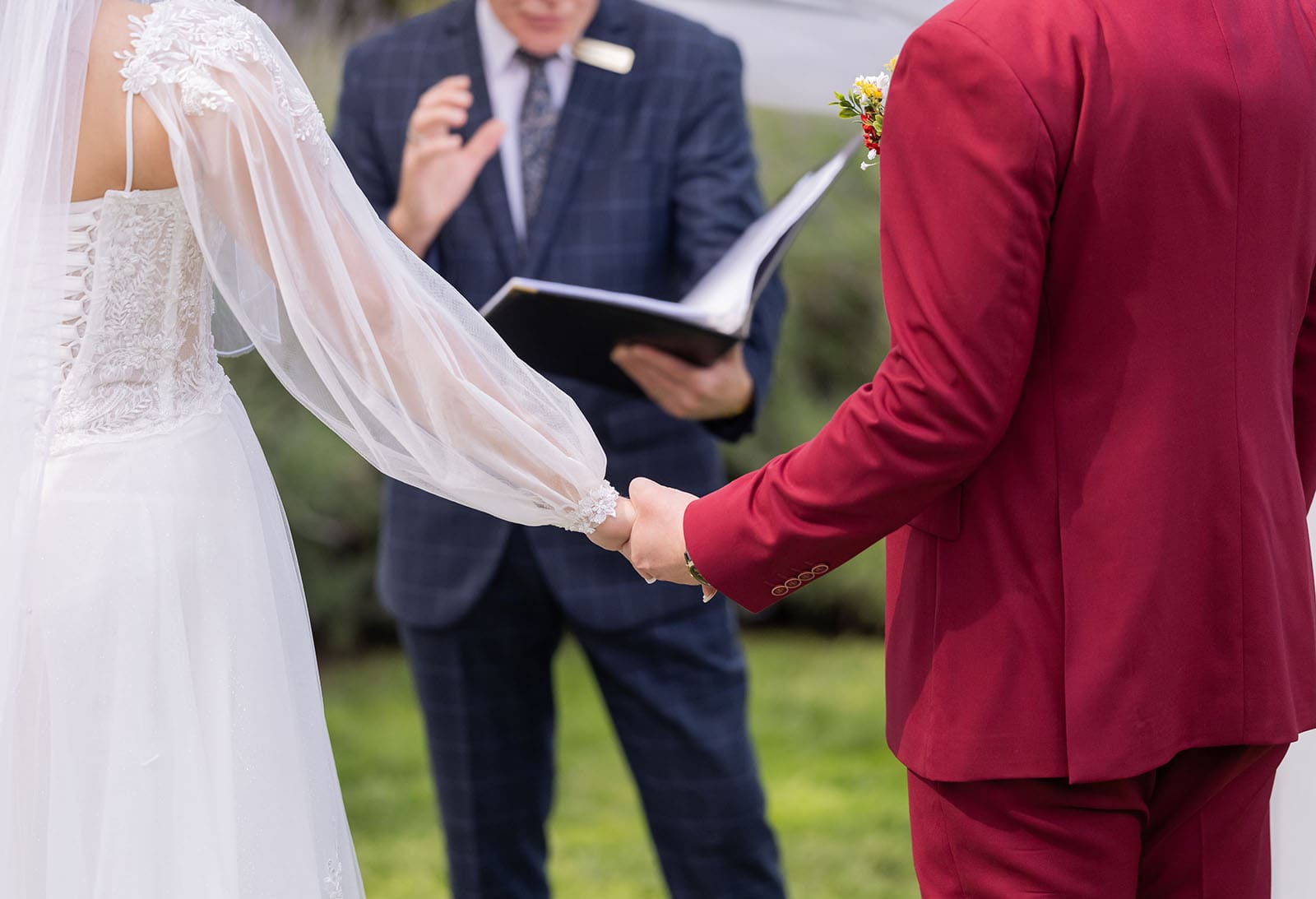 templewood house wedding - michelle & andrew 15 Holding hands during ceremony