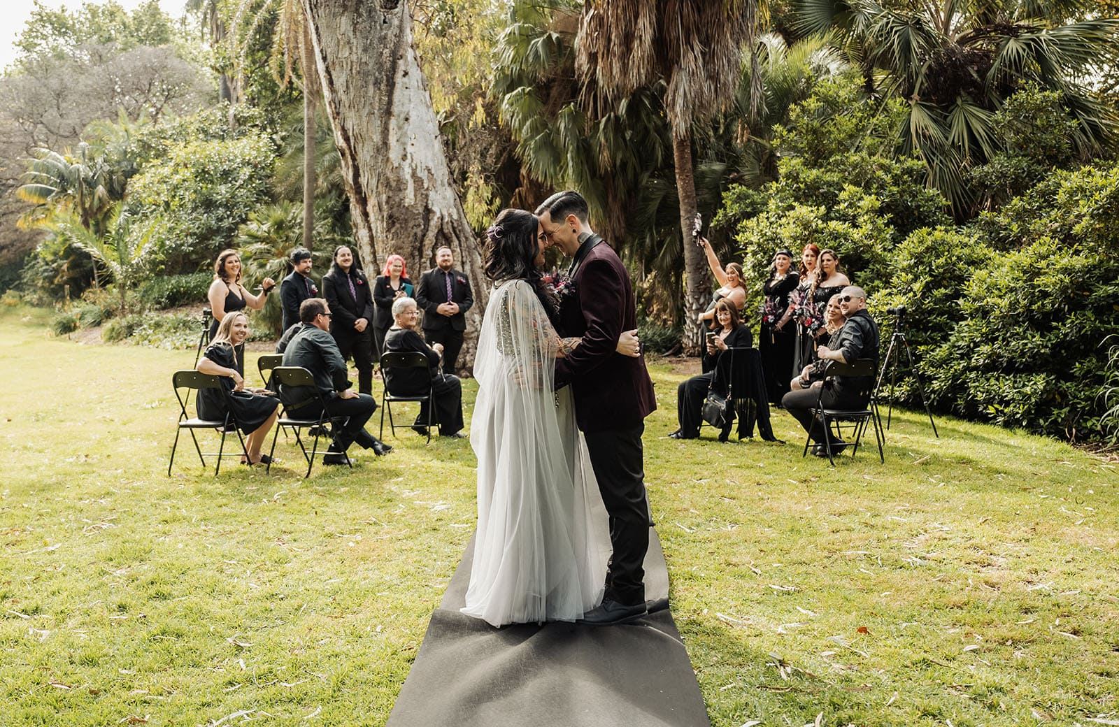 palm house gardens wedding - ayla & drew 155 Kiss at end of aisle