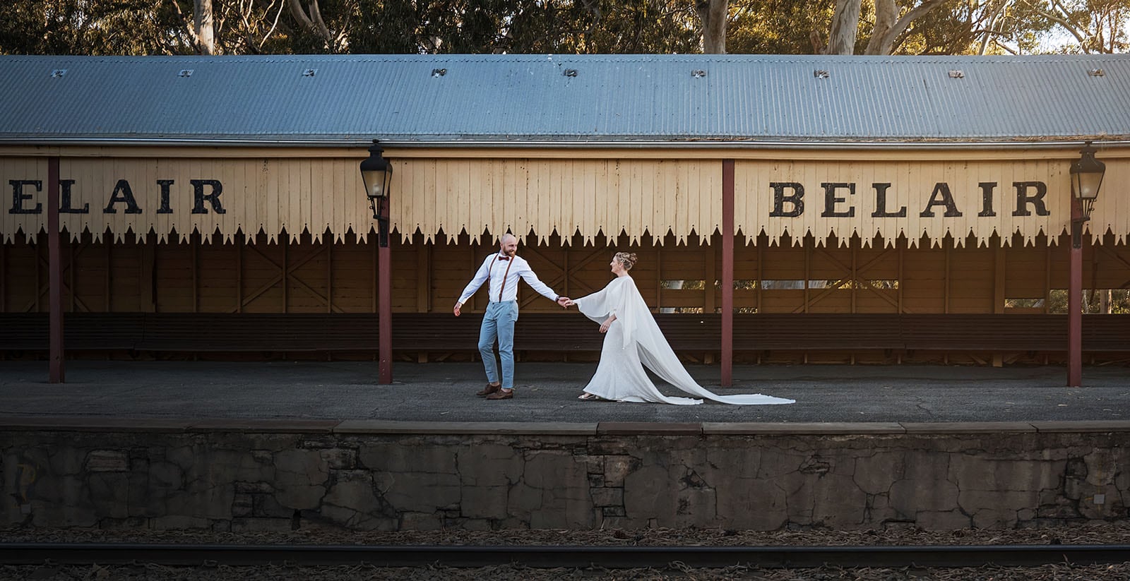 belair national park engagement shoot - lindsey & jaden 9 Wedding couple holding hands at Belair train station