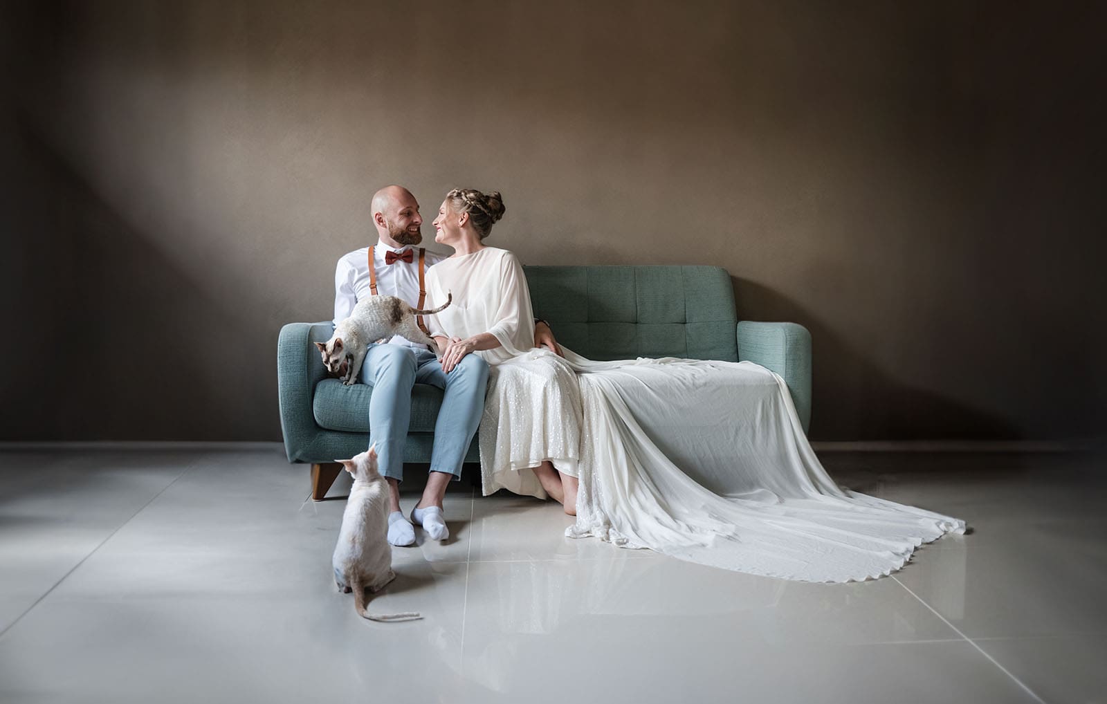 belair national park engagement shoot - lindsey & jaden 6 Couple with cat on couch in elegant attire
