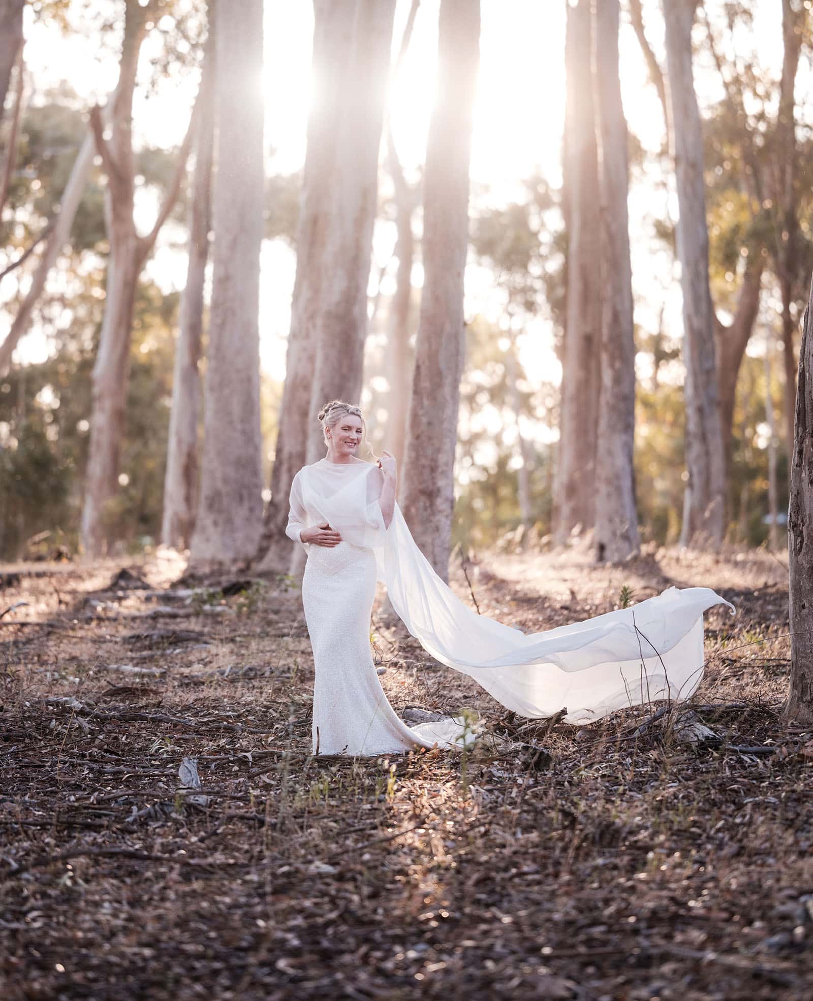belair national park engagement shoot - lindsey & jaden 20 Bride in forest sunlight with flowing veil