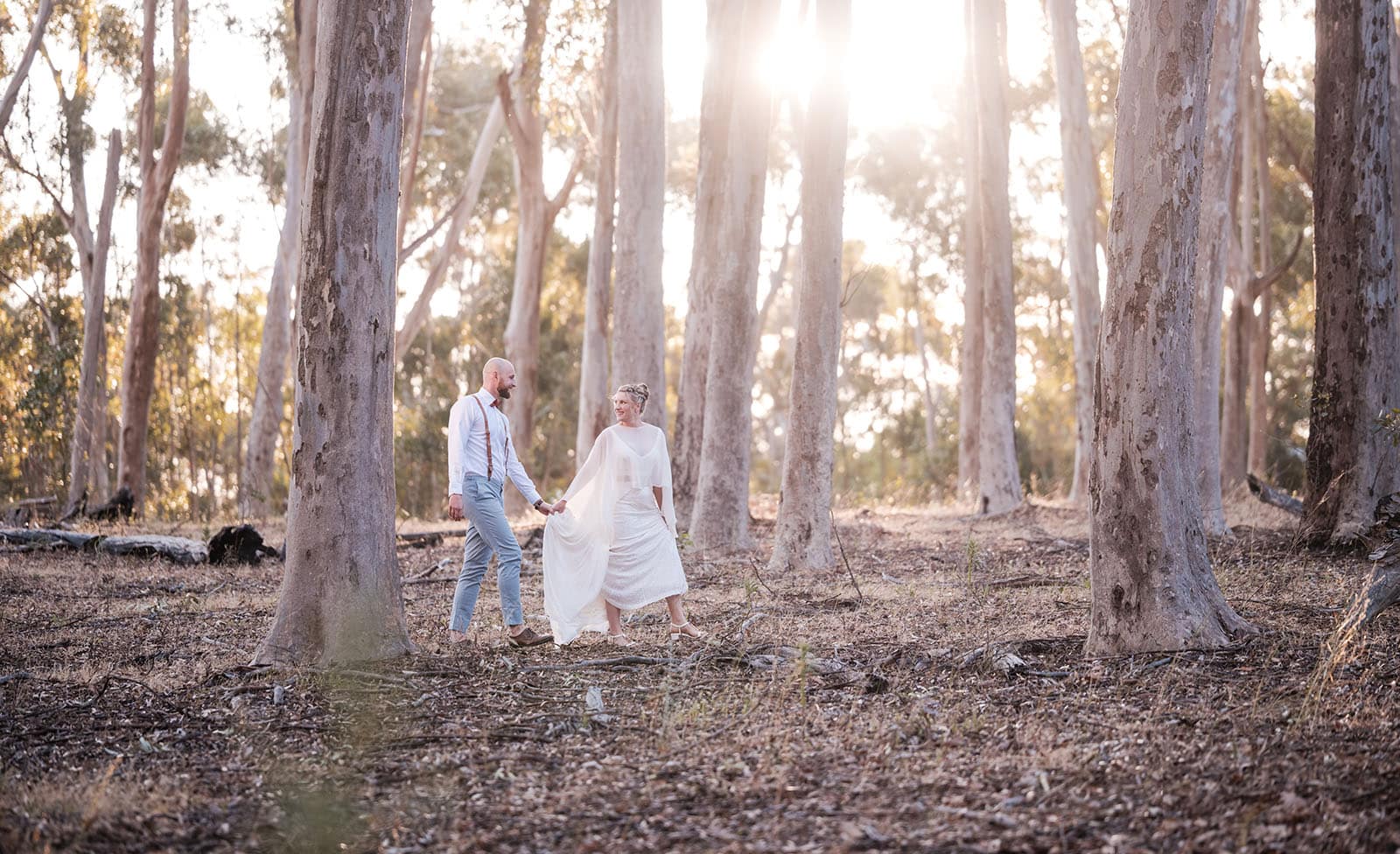 belair national park engagement shoot - lindsey & jaden 18 Couple holding hands in forest sunset wedding