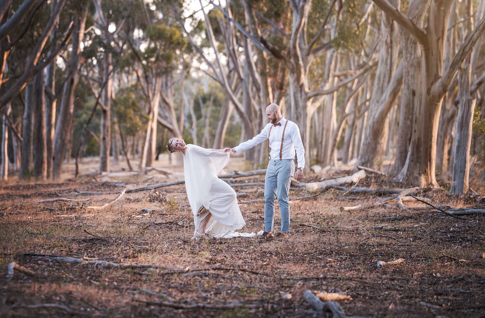 belair national park engagement shoot - lindsey & jaden 27 Couple dancing in forest at sunset