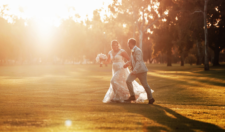 Newlywed couples sunset stroll at veale garden wedding