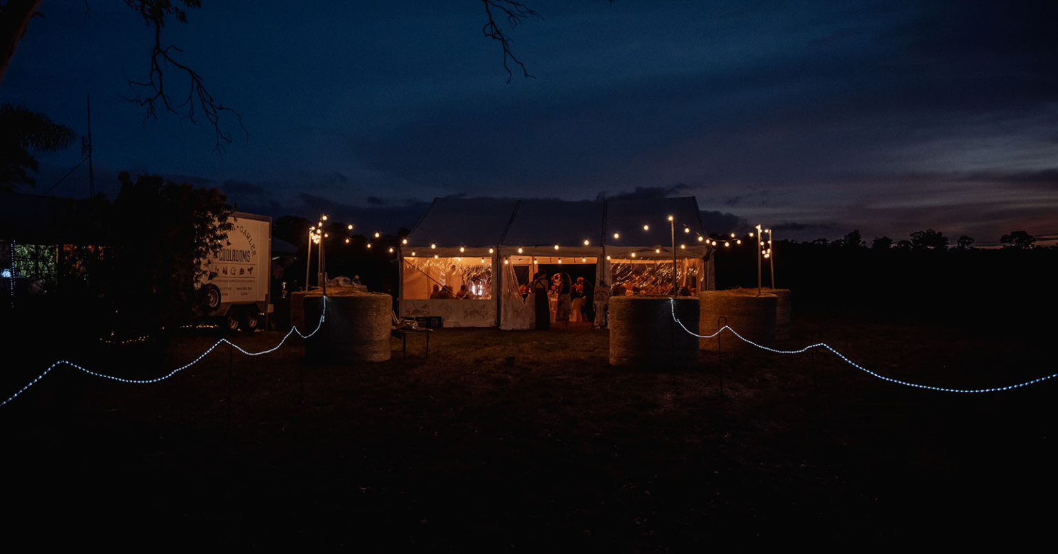 langmeil lutheran church wedding - cassie & corben 43 Evening celebration with ambient string lighting outdoors.