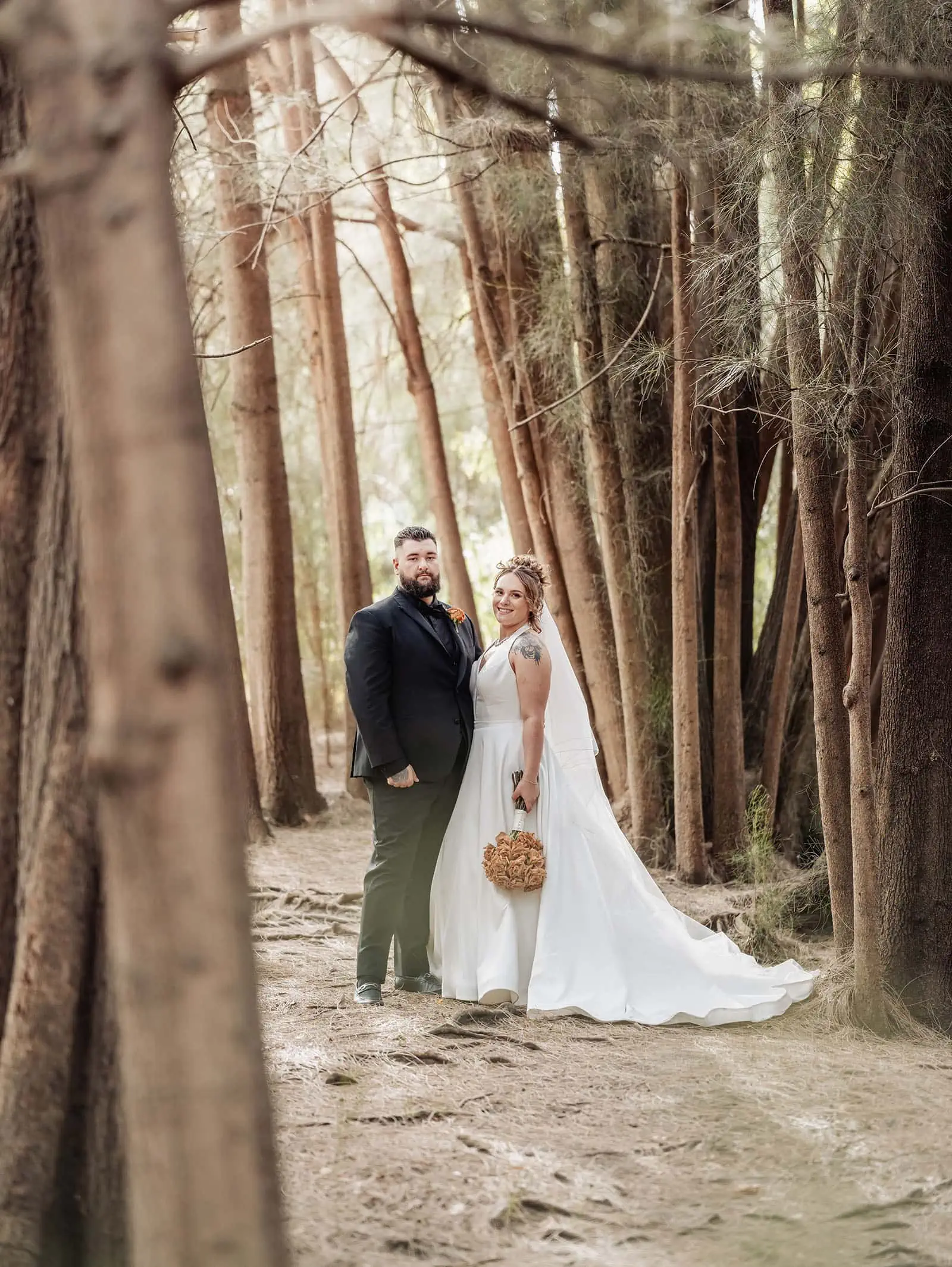 botanic gardens, araucaria avenue wedding - jade & hazim 58 Bride and groom in serene forest setting on their wedding day.