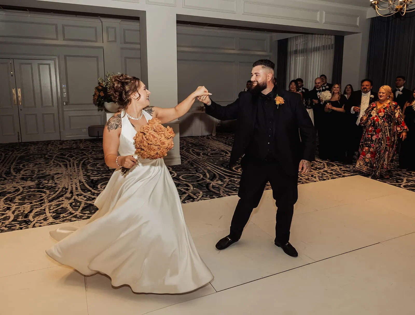 botanic gardens, araucaria avenue wedding - jade & hazim 66 Bride and groom joyously dancing at their elegant wedding reception.