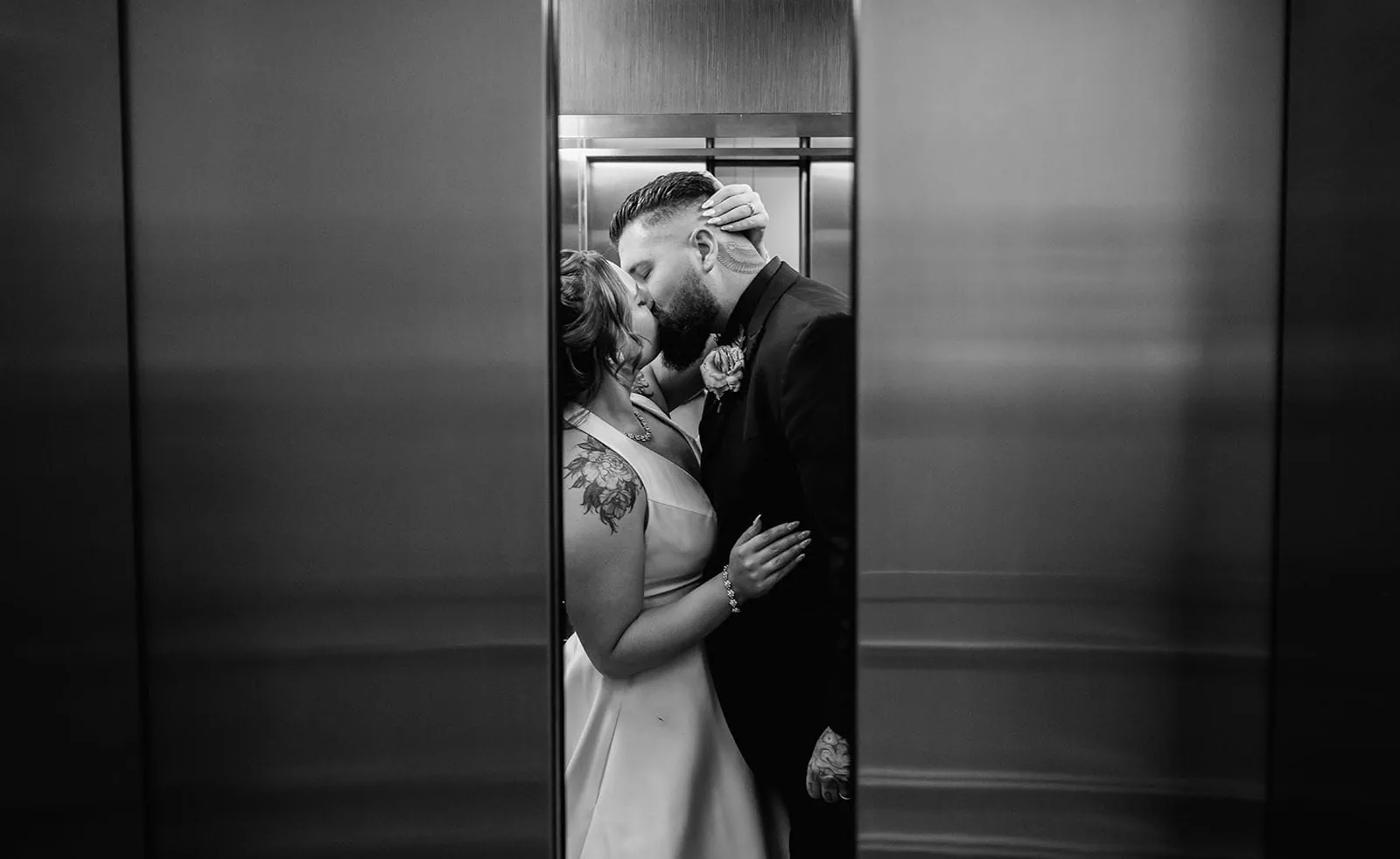 botanic gardens, araucaria avenue wedding - jade & hazim 67 Couple in formal attire sharing a close intimate moment in an elevator.