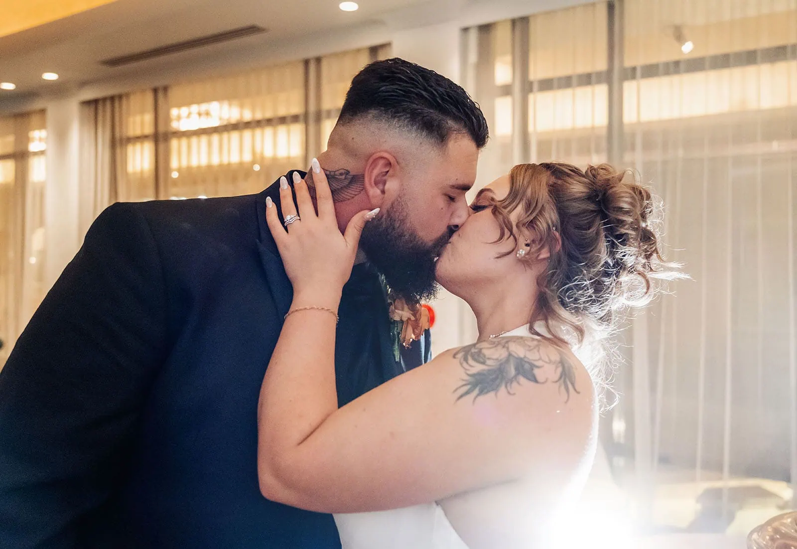 botanic gardens, araucaria avenue wedding - jade & hazim 68 Bride and groom sharing a romantic kiss during their luxurious wedding celebration.