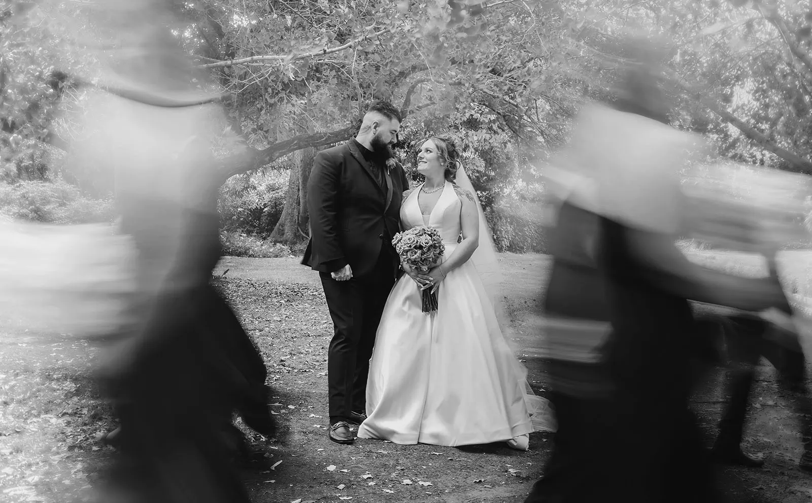 botanic gardens, araucaria avenue wedding - jade & hazim 49 Bride and groom share intimate moment in black and white wedding photography.